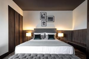 Postel nebo postele na pokoji v ubytování Hotel Osijek