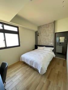 Postel nebo postele na pokoji v ubytování Zhuluowan Club