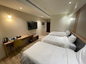 Postel nebo postele na pokoji v ubytování Zhuluowan Club
