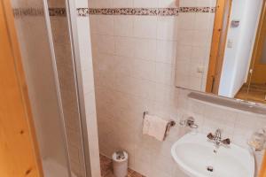 a bathroom with a sink and a shower at Möslehof in Kauns +34 photos