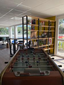 a billiard room with a table and a pool table sidx sidx at Campanile Montpellier Ouest - Croix D'Argent in Montpellier