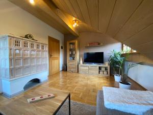 a large living room with a television and a table at Ferienwohnung Böllatblick in Balingen