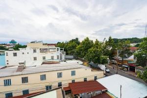 an overhead view of a city with buildings and trees at Khách Sạn Tràng An in Thu Dau Mot