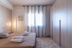 Posteľ alebo postele v izbe v ubytovaní Angy Apartment