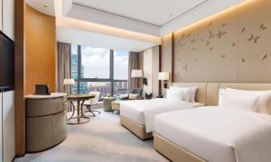 TV a/nebo společenská místnost v ubytování Radisson Collection, Wuxi