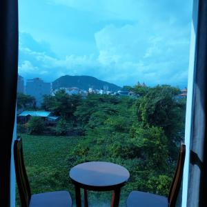 a view from a room with a table and chairs at Biển Vàng - New Golden Sea in Vung Tau