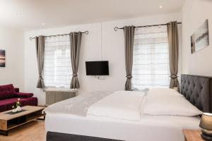 Postel nebo postele na pokoji v ubytování Central-Inn Werfen