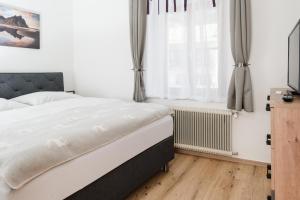 Postel nebo postele na pokoji v ubytování Central-Inn Werfen