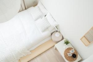 Postel nebo postele na pokoji v ubytování Miyako Shinjuku Hotel 都-新宿-