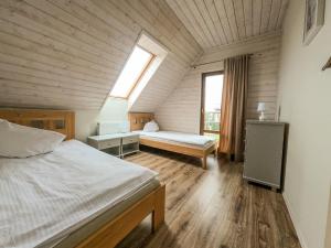 Postel nebo postele na pokoji v ubytování Komfortowy Dom Szafranki