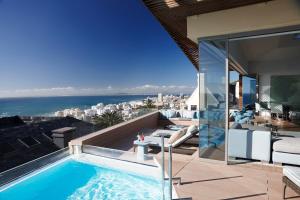 a swimming pool on the roof of a house at Ellerman House in Cape Town