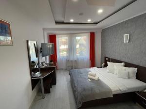 TV a/nebo společenská místnost v ubytování Silver Hotel