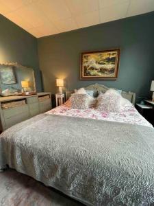 a bedroom with a large bed in a room at Redefined Alchemy - The Studio in Little Falls