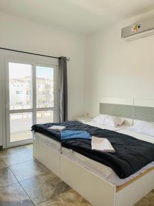 Cama ou camas em um quarto em Elite Residence Dahab