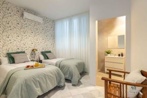 Posteľ alebo postele v izbe v ubytovaní Living4Malaga Stylish Monroy