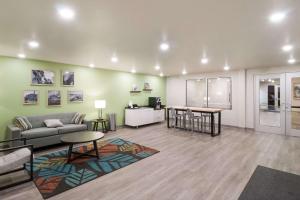 a living room with a couch and a table at WoodSpring Suites Mesa Chandler in Mesa