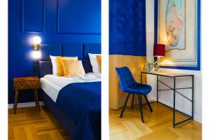 a bedroom with blue walls and a blue bed and a chair at Glamorous Apartment in heart of Old Town in Krakow