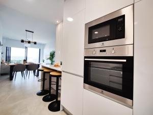 A cozinha ou cozinha compacta de SUNSET CLIFFS sea view apartments