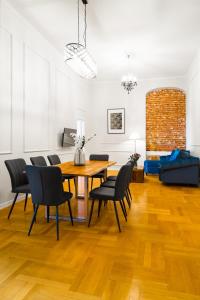 a dining room with a table and chairs at Glamorous Apartment in heart of Old Town in Krakow