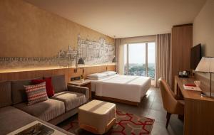 Postel nebo postele na pokoji v ubytování Hyatt Place Jaipur Malviya Nagar