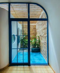 an internal view of a room with a glass door at MOONLIGHT Homestay & Hotel in Pleiku