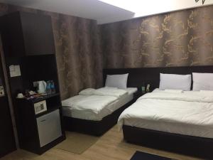 Postel nebo postele na pokoji v ubytování 7 Hotel