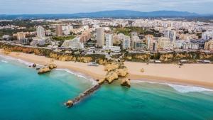 an aerial view of a beach and a city at Rochato Dreams in Portimão