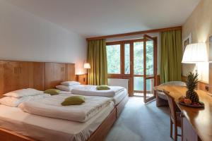Postel nebo postele na pokoji v ubytování Hotel Restaurant Südrast Dreiländereck