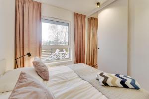Posteľ alebo postele v izbe v ubytovaní Apartament SAND SurfingBird Dźwirzyno