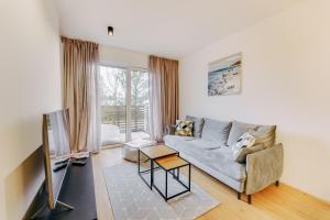Televízia a/alebo spoločenská miestnosť v ubytovaní Apartament SAND SurfingBird Dźwirzyno