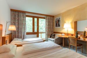 Postel nebo postele na pokoji v ubytování Hotel Restaurant Südrast Dreiländereck