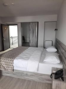 Voodi või voodid majutusasutuse Aventus Hotel toas