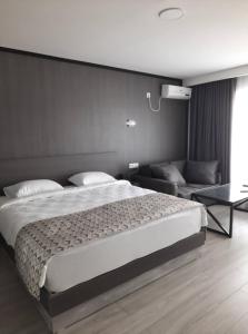Voodi või voodid majutusasutuse Aventus Hotel toas