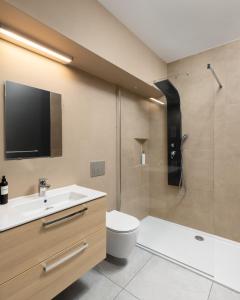 a bathroom with a sink and a toilet and a shower at Moje Miejsce Jura in Kroczyce