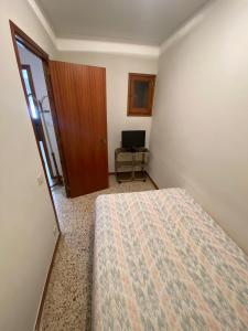 Postel nebo postele na pokoji v ubytování Apartaments Sant Antoni