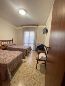 Postel nebo postele na pokoji v ubytování Apartaments Sant Antoni
