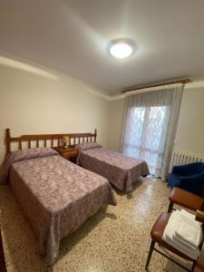 Postel nebo postele na pokoji v ubytování Apartaments Sant Antoni