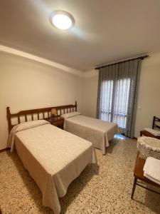 Postel nebo postele na pokoji v ubytování Apartaments Sant Antoni