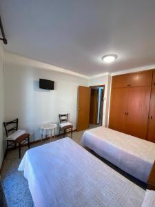 Postel nebo postele na pokoji v ubytování Apartaments Sant Antoni