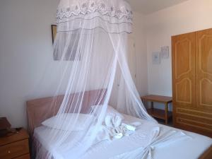 Postel nebo postele na pokoji v ubytování Poros View