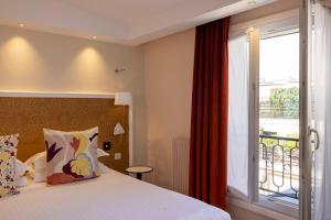 Postel nebo postele na pokoji v ubytování Hotel Elysees 8
