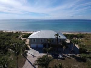an aerial view of a house on the beach at Private Oceanfront Escape: Kayaks, Sunsets, Coral! in Hope Estate