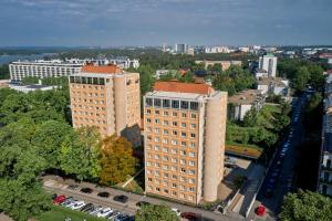 an overhead view of a tall building in a city at Töölö Towers in Helsinki
