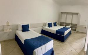 Cama o camas de una habitación en Summit Suítes Hotel Cachoeira Paulista