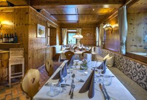 a dining room with a long table in it at Appartementhaus Madlen in Hinterstoder