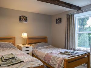 Säng eller sängar i ett rum på Yew Tree Cottage
