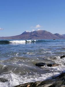 a body of water with a mountain in the background at Kylemore House boutique apartments - Fishermans Perch in Kylemore