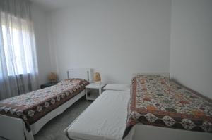 Postel nebo postele na pokoji v ubytování Il Balcone sull'Isola