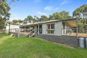 a modular home with a porch and a deck at Beach Side in Aireys Inlet