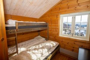 Postel nebo postele na pokoji v ubytování Sirdal Mountain Lodge, ski in-out